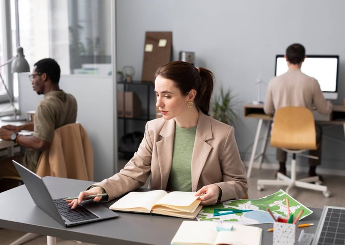 Professional in business attire reviewing documents during a relocation