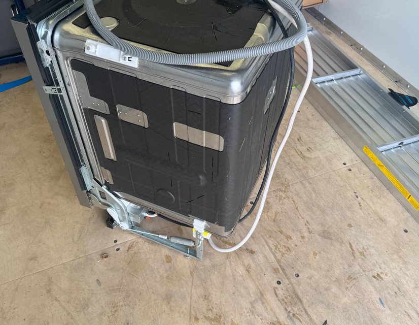 Washing machine wrapped and strapped for appliance installation