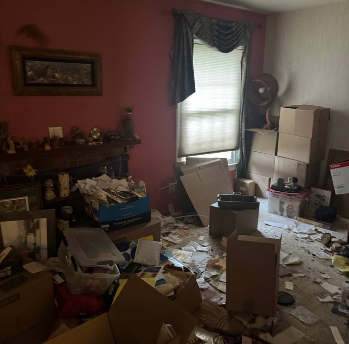 Cluttered room awaiting move-out cleanout