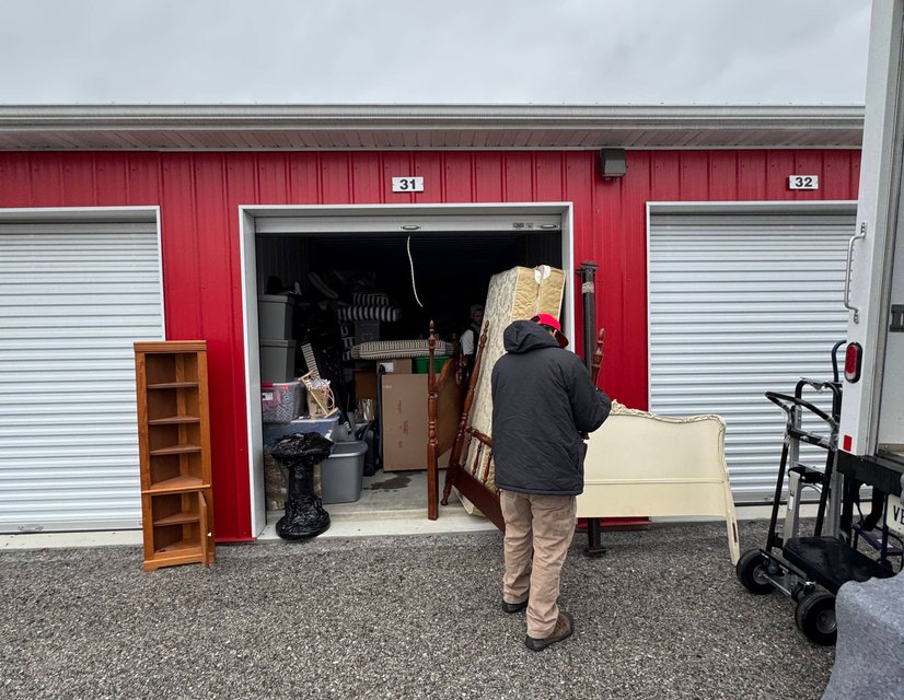 OneMove crew loading donation items at a storage unit