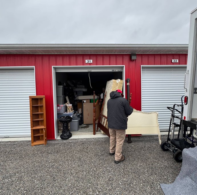 OneMove crew loading donation items at a storage unit